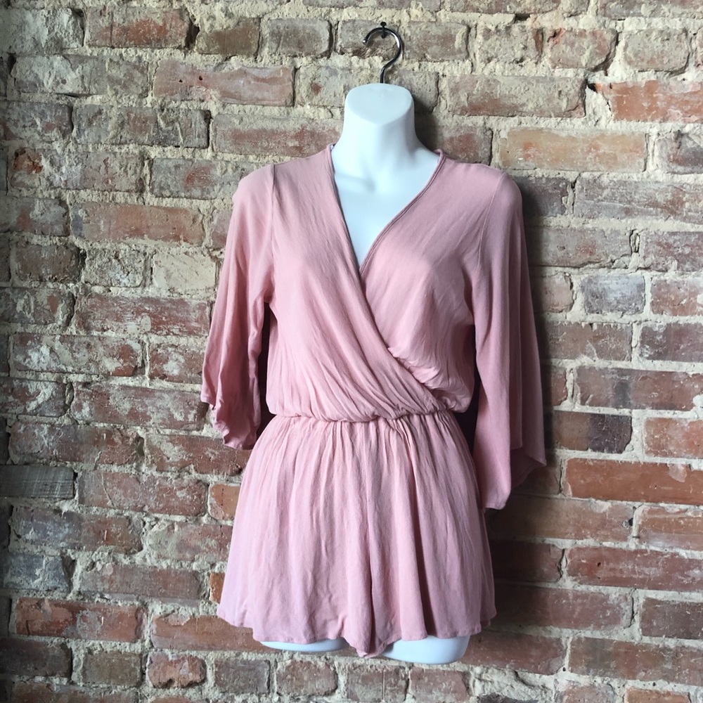 Size S Cute little pink romper.